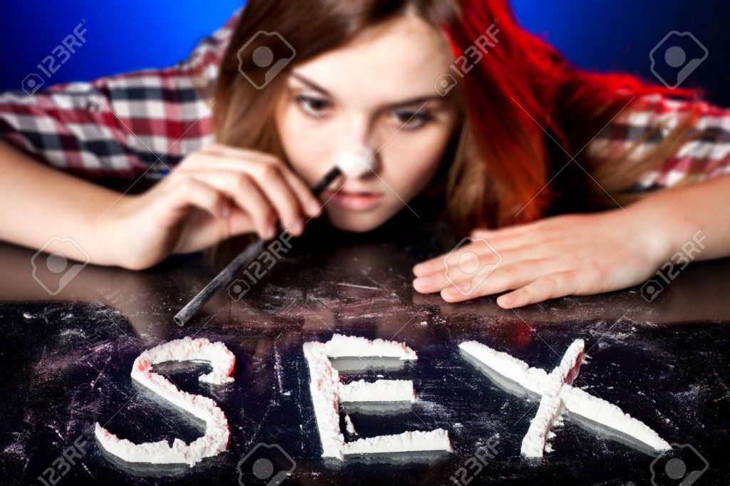 Woman snorting cocaine or amphetamines, sex addiction